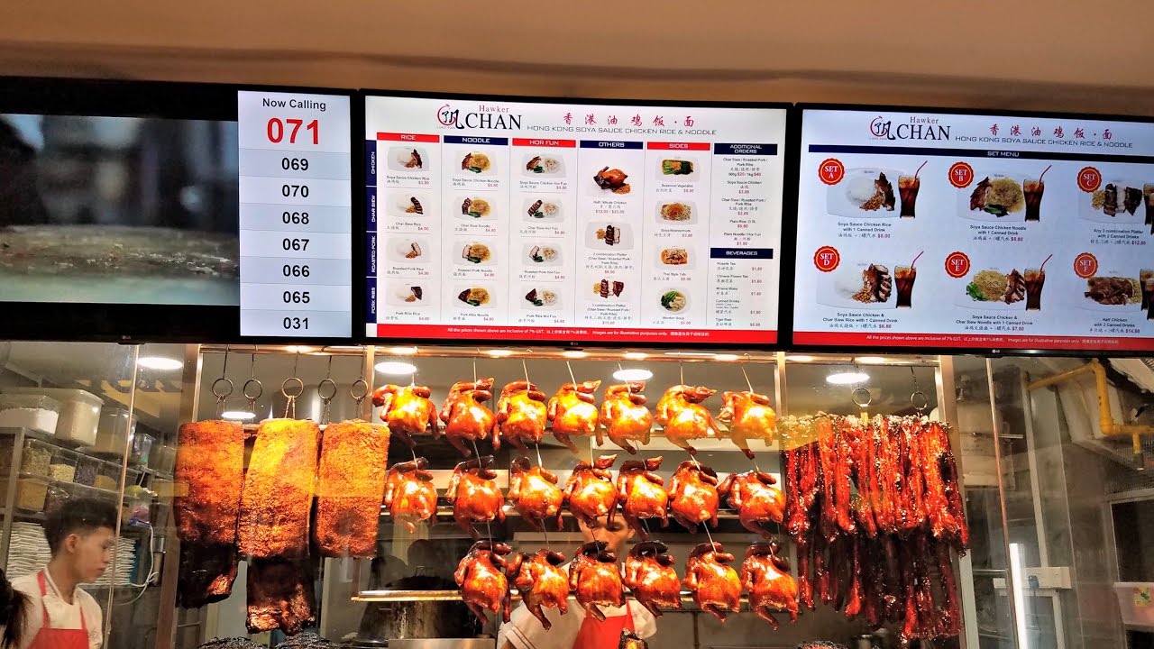 A small food stand with electronic menus and food hanging on displayPicture